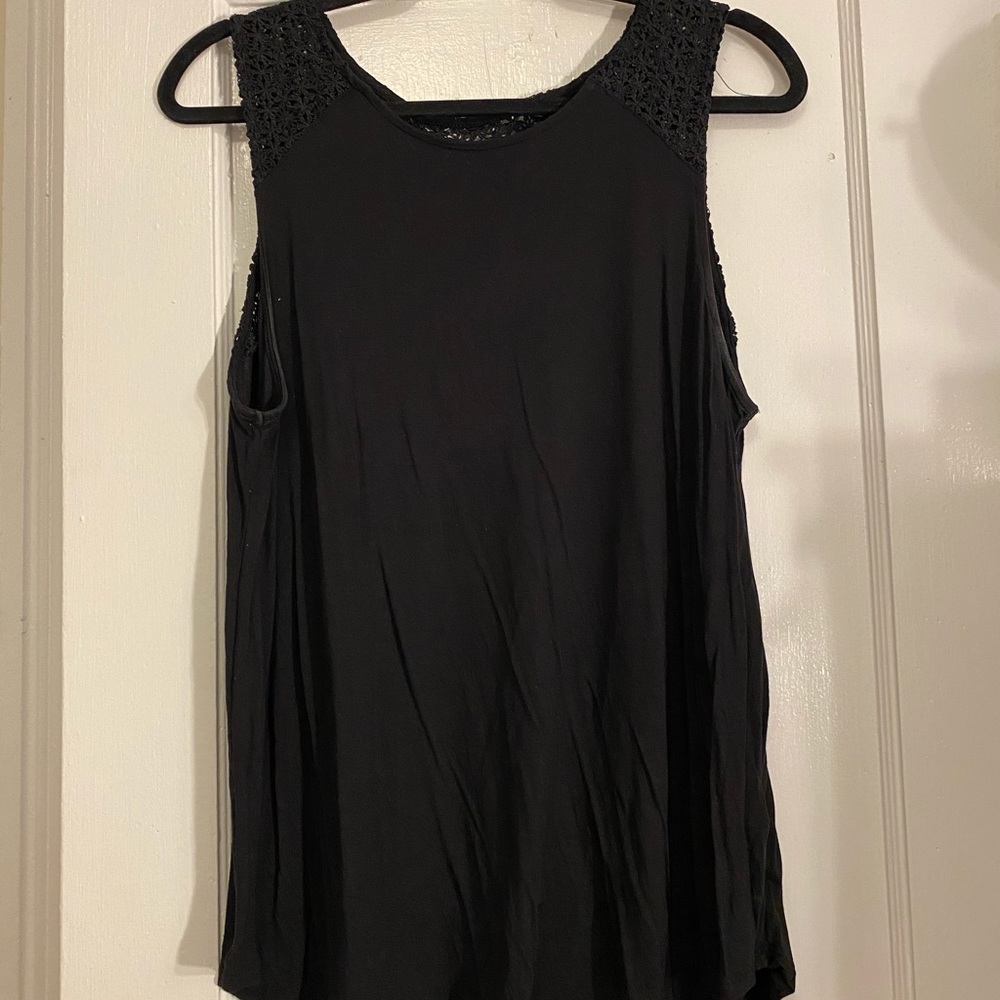 Black sleeveless blouse with lace accent